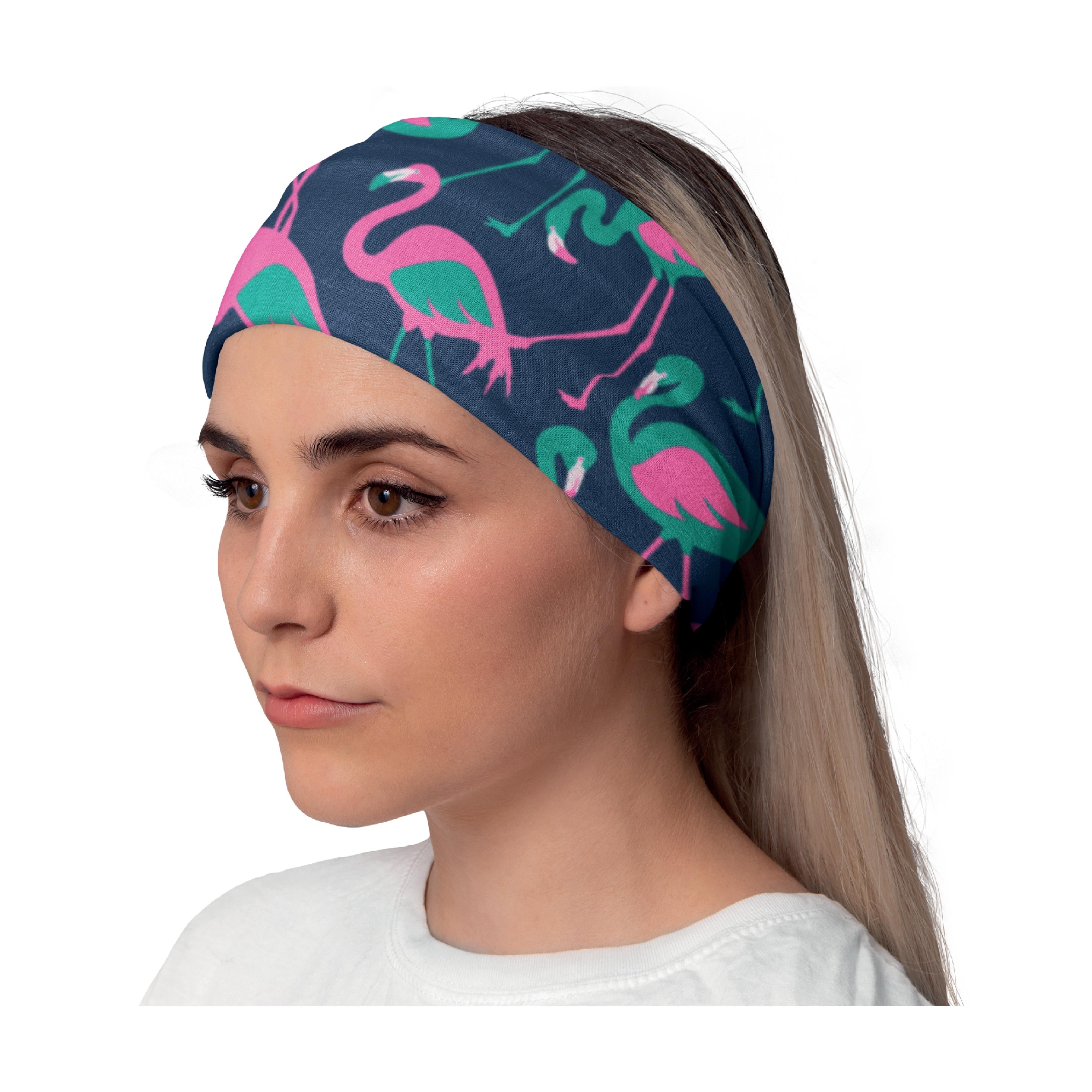 Close-up side profile of a young woman wearing a Lunabands headband featuring a fun navy blue flamingo print with bright pink and green details. Perfect for running, yoga, and everyday wear.