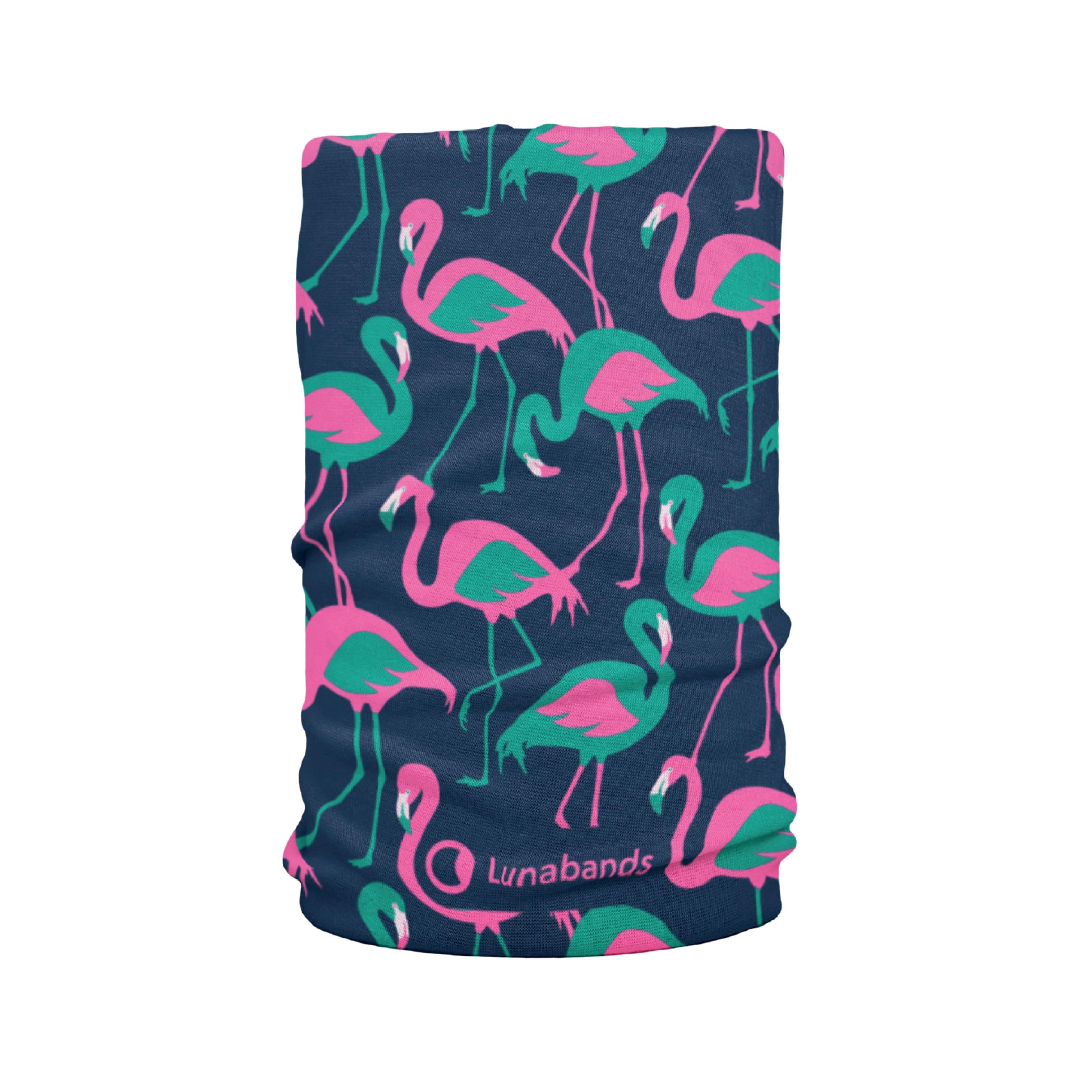 Close-up side profile of a young woman wearing a Lunabands headband featuring a fun navy blue flamingo print with bright pink and green details. Perfect for running, yoga, and everyday wear.